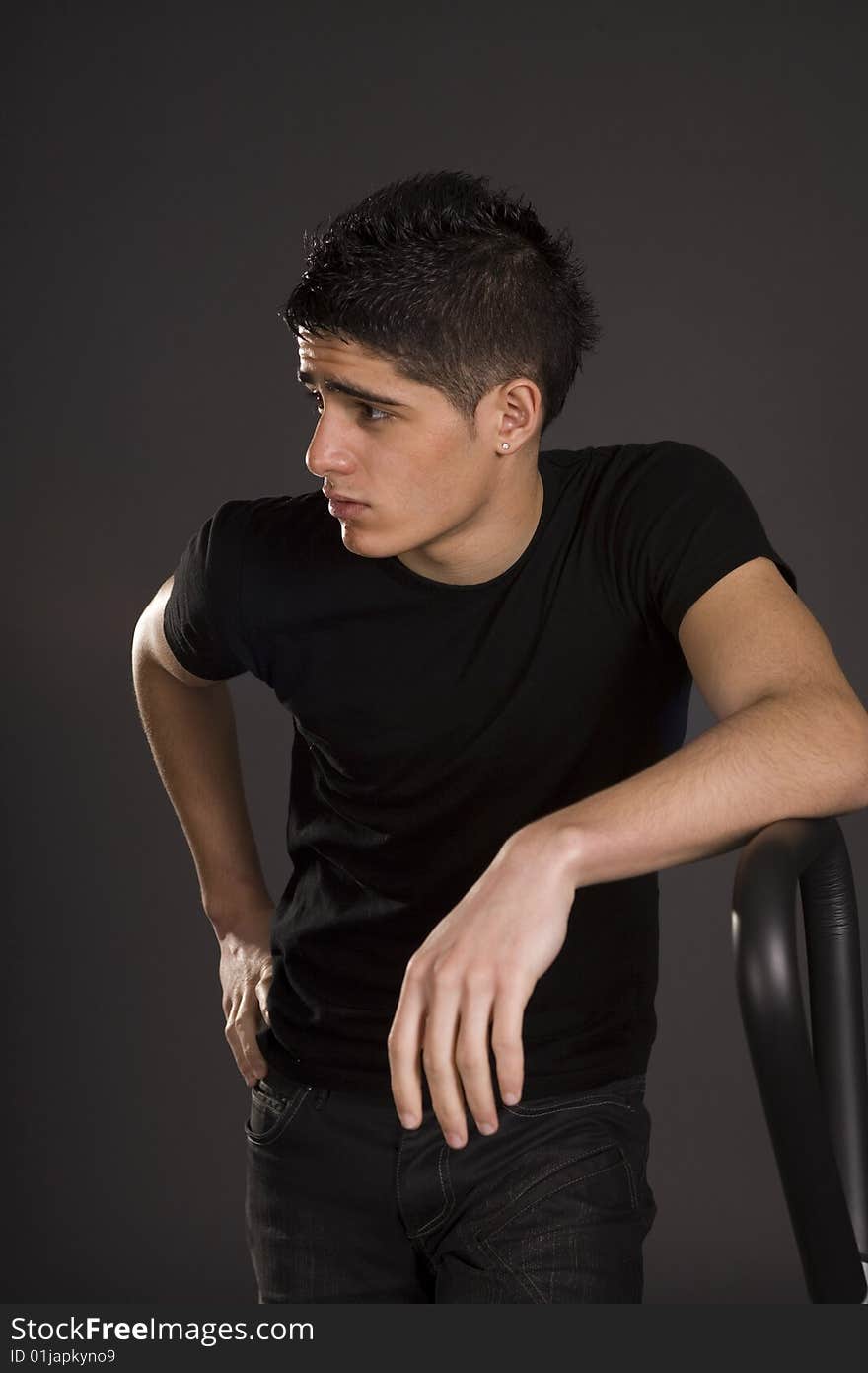 Fashion portrait of teenager over grey background