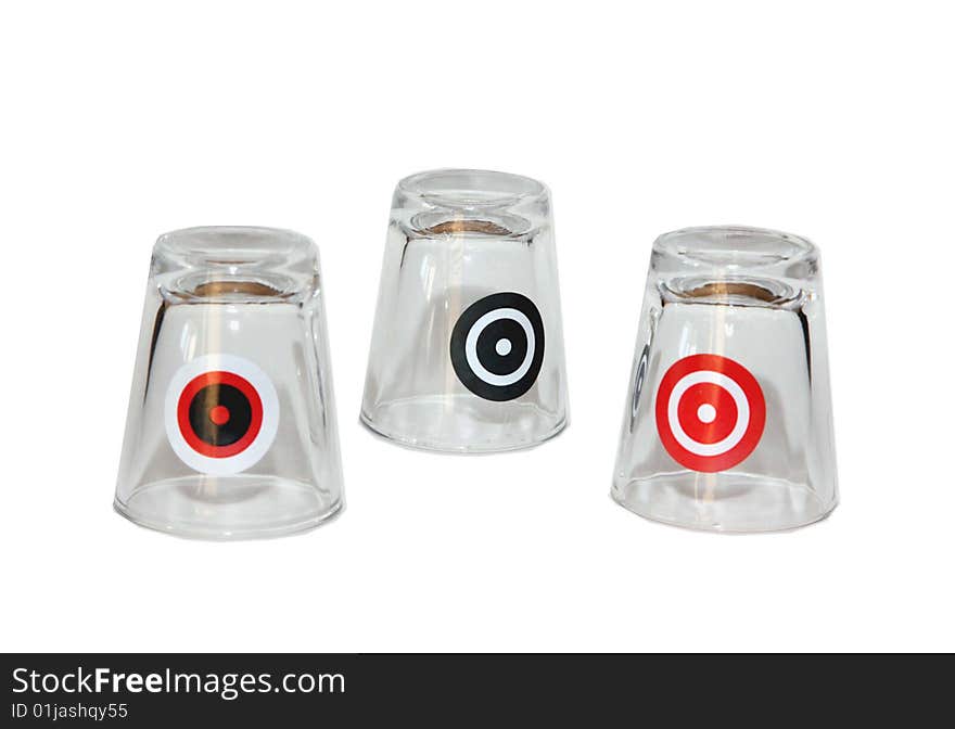 Three shot glasses with targets on them