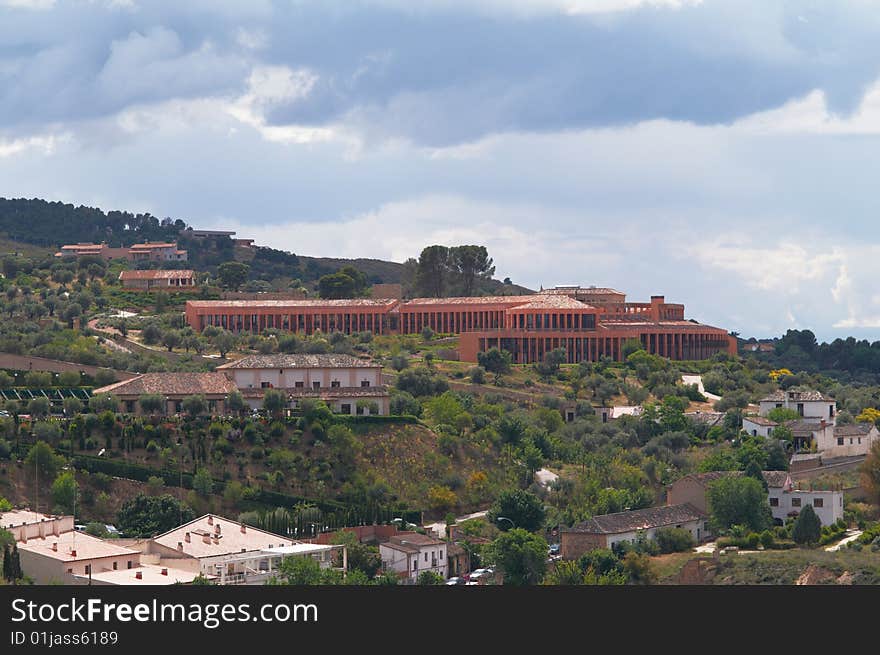 Cityscape of the old houses in a Castillian style contrasted by rainy sky