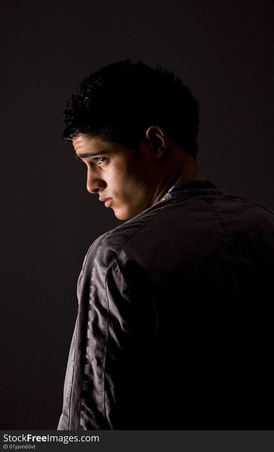 Fashion portrait of teenager over grey background