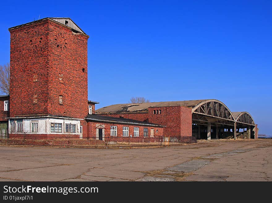 Ruins of abandoned military airfield, hangars, tower. Ruins of abandoned military airfield, hangars, tower