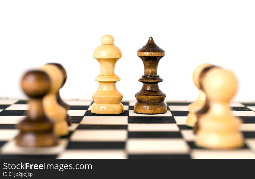 White and black chess figures on chessboard. White and black chess figures on chessboard.