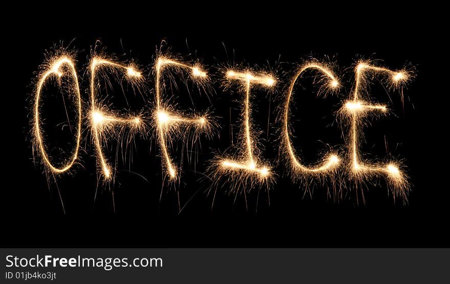 Word office written sparkler on dark