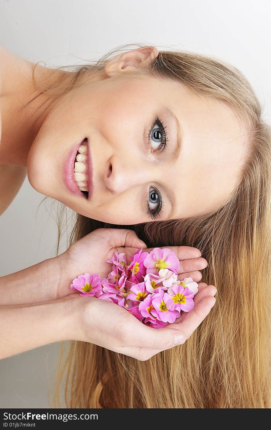 Beautiful blond woman with flower in spa. Beautiful blond woman with flower in spa