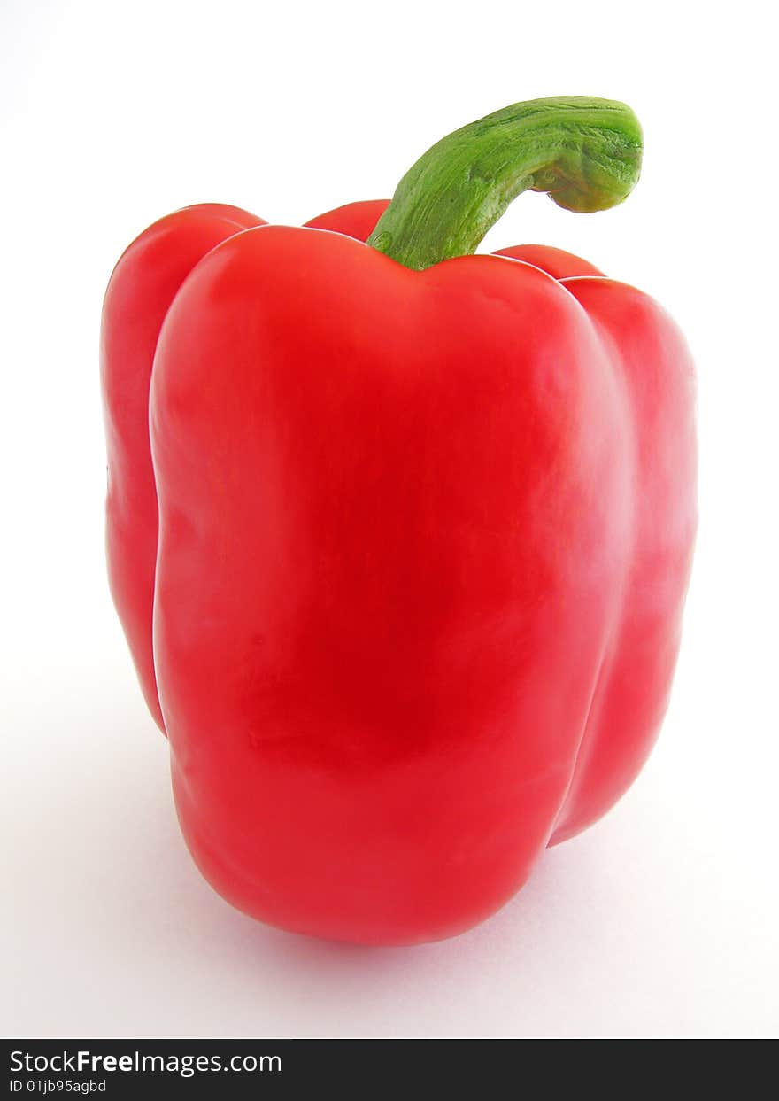 Bright red pepper isolated on white background