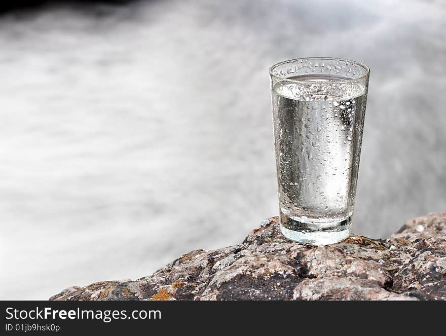 One glass of water in nature