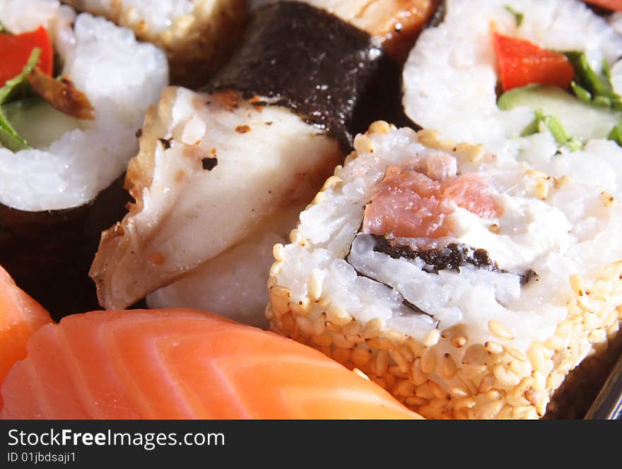 The Japanese meal with rice, a fish and sea seaweed.