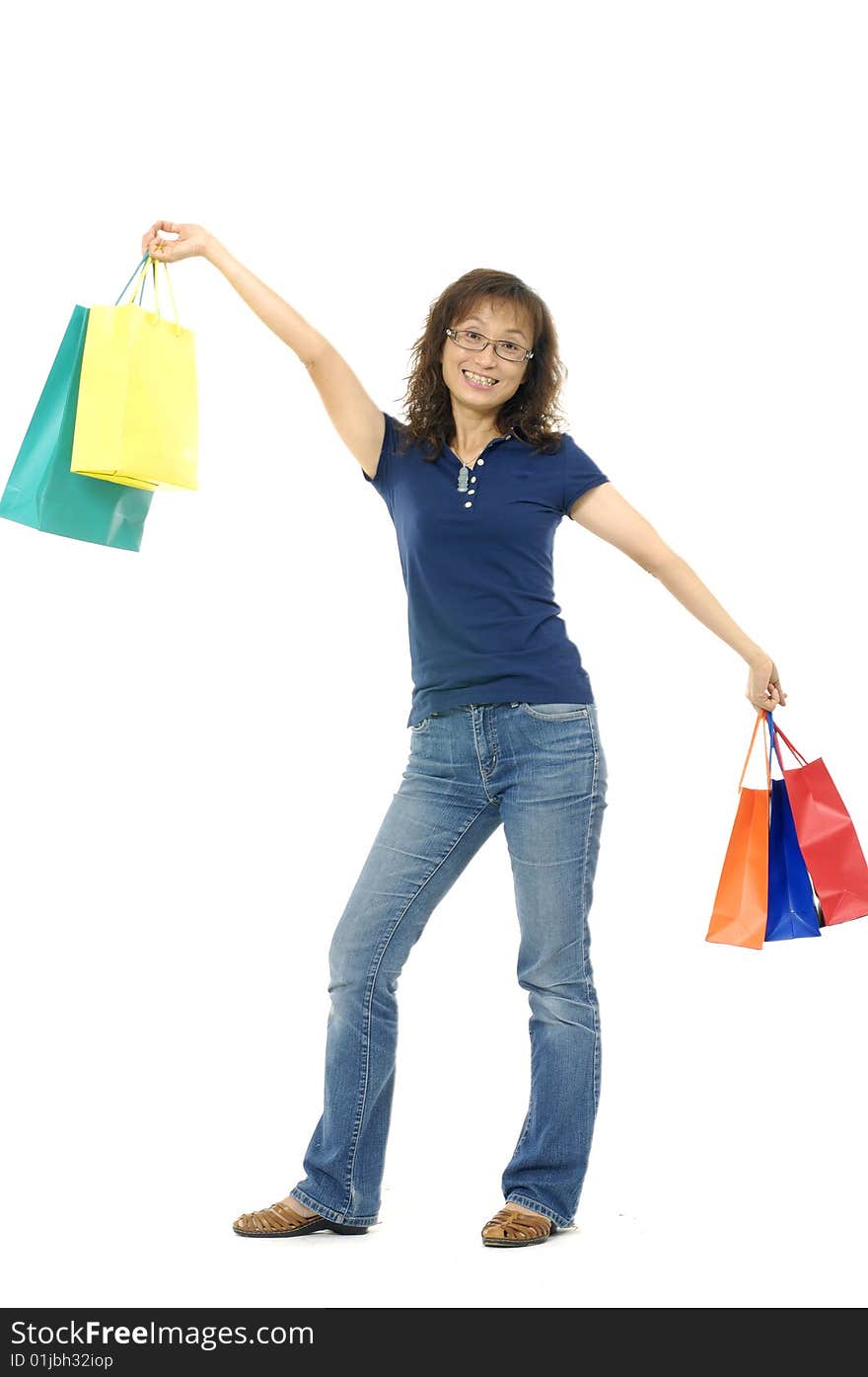 Happy young adult girl with colored bags. Happy young adult girl with colored bags