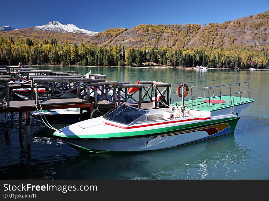 Boat resting at pier at the kanas river in xinjiang,china. Boat resting at pier at the kanas river in xinjiang,china