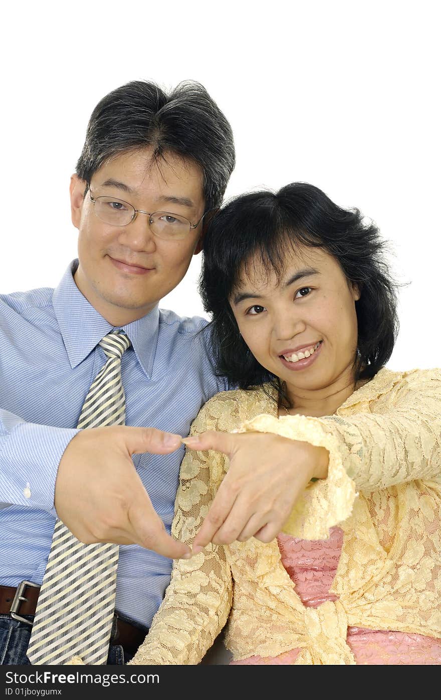 Couple hands forming a heart symbol. Couple hands forming a heart symbol