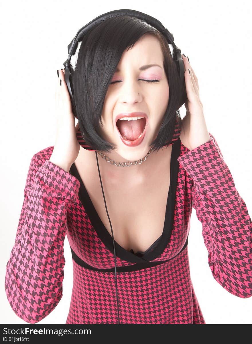 Emo girl in head phones on white background