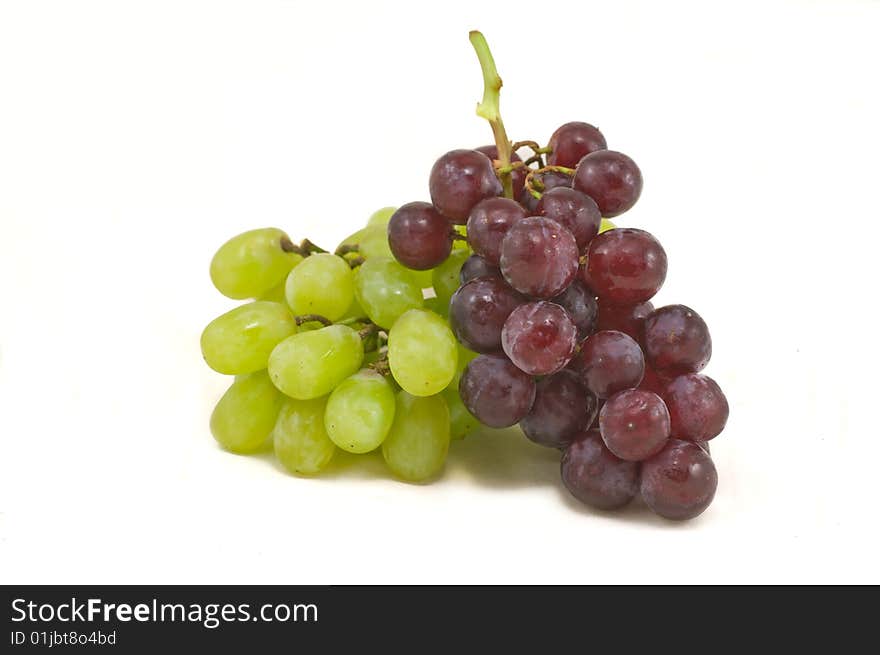 Cluster of red and white grapes isolated on white. Cluster of red and white grapes isolated on white