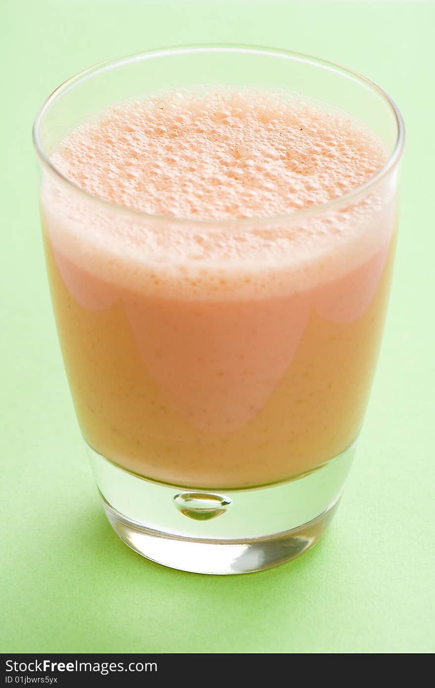 Delicious refreshing strawberry orange banana milkshake natural isolated. Delicious refreshing strawberry orange banana milkshake natural isolated