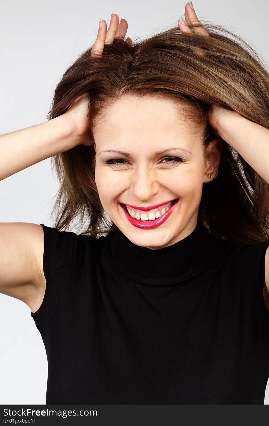 Young and happy woman with raised hair