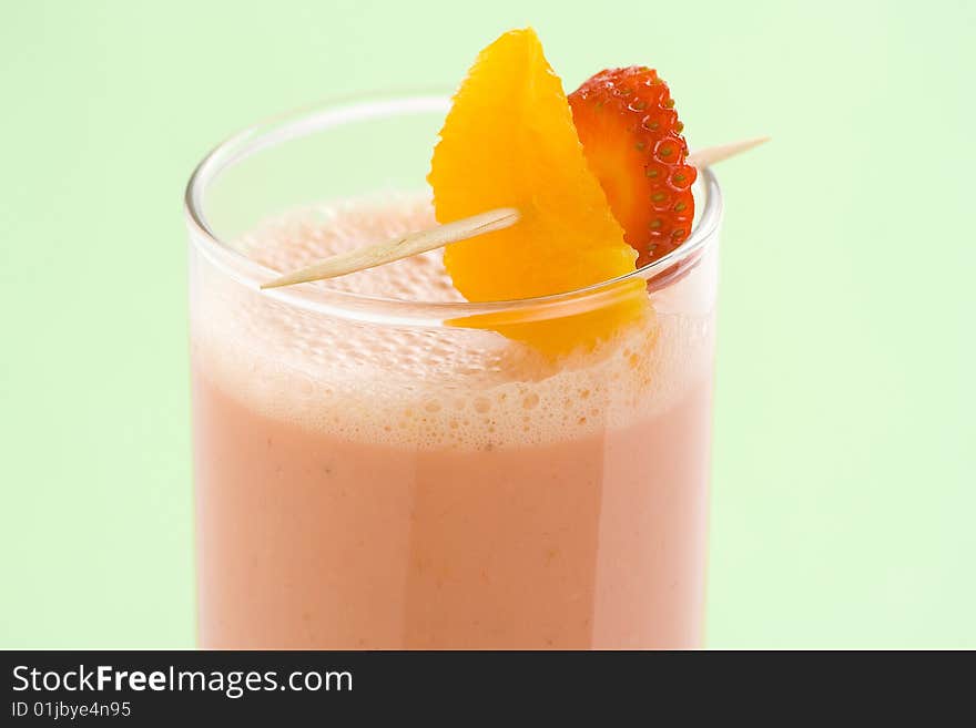Delicious refreshing strawberry orange banana milkshake natural isolated. Delicious refreshing strawberry orange banana milkshake natural isolated