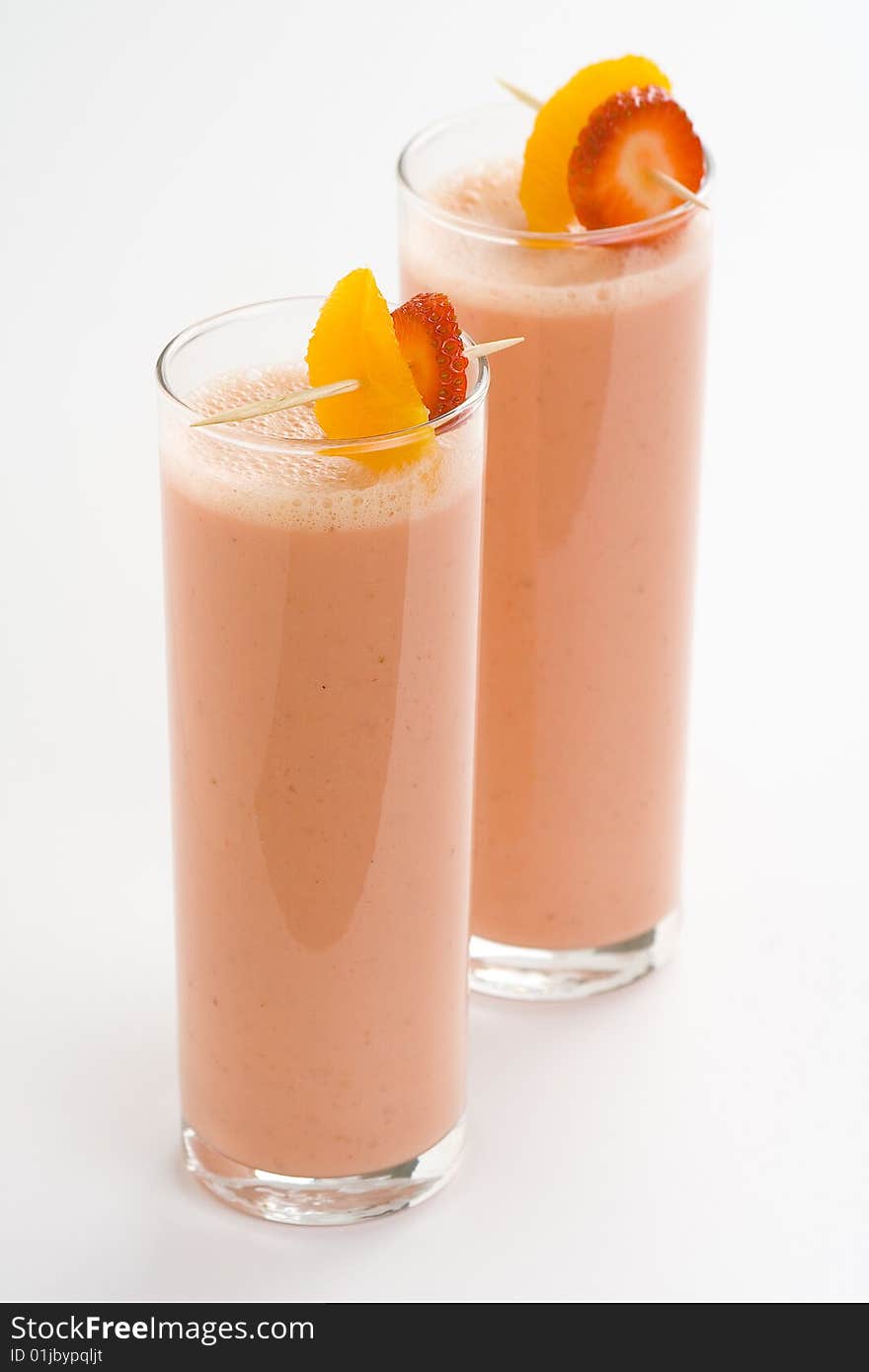 Delicious strawberry orange banana milkshake