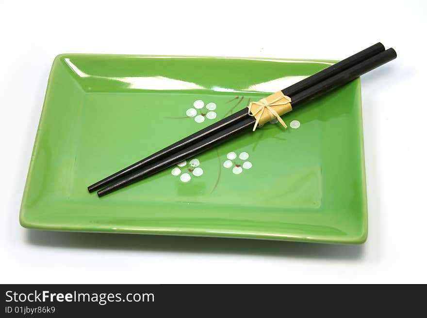 Japanese chopsticks on a plate. Japanese chopsticks on a plate