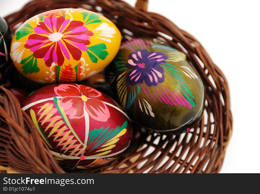 A closeup of easter eggs in a basket