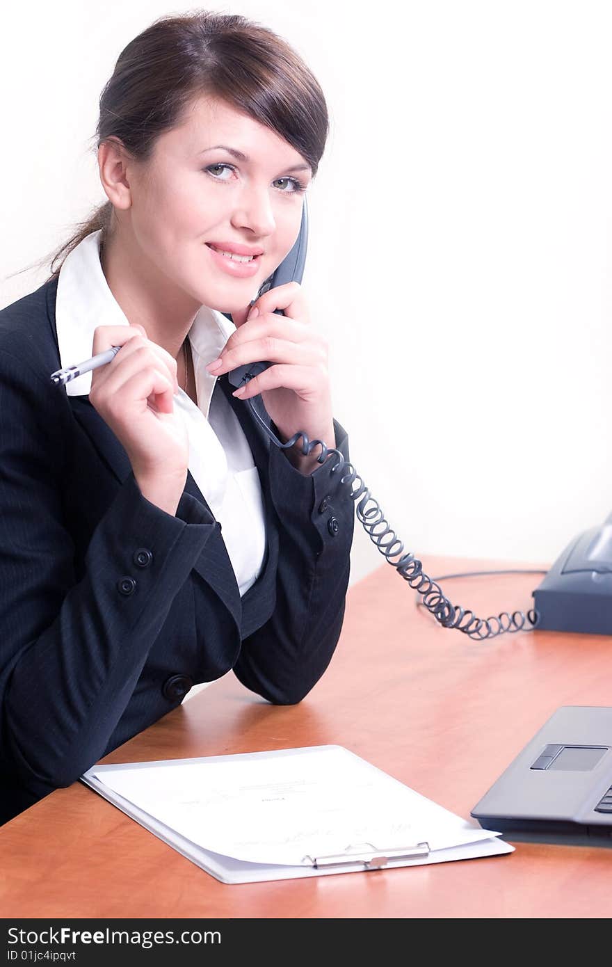 Portrait of young beautiful woman in office environment