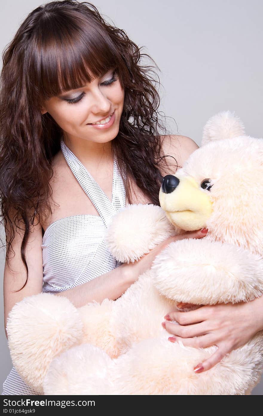 Beautiful girl with a teddy bear