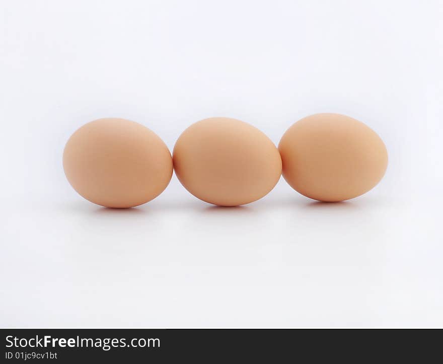 Three eggs on white background