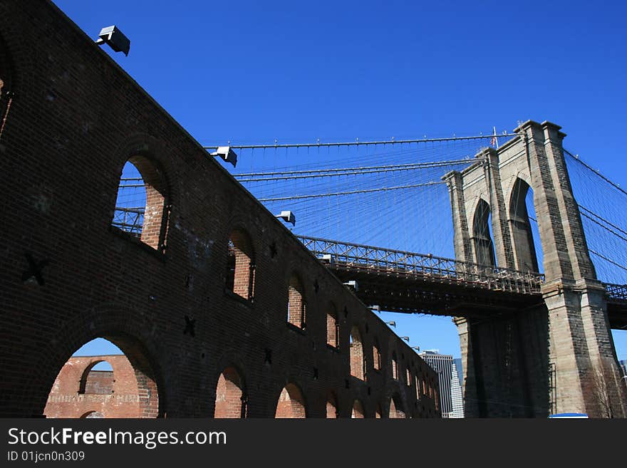 Building facade below the Brooklyn Bridge.