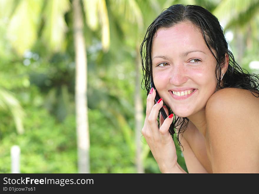 Beautiful young woman talking on cellphone