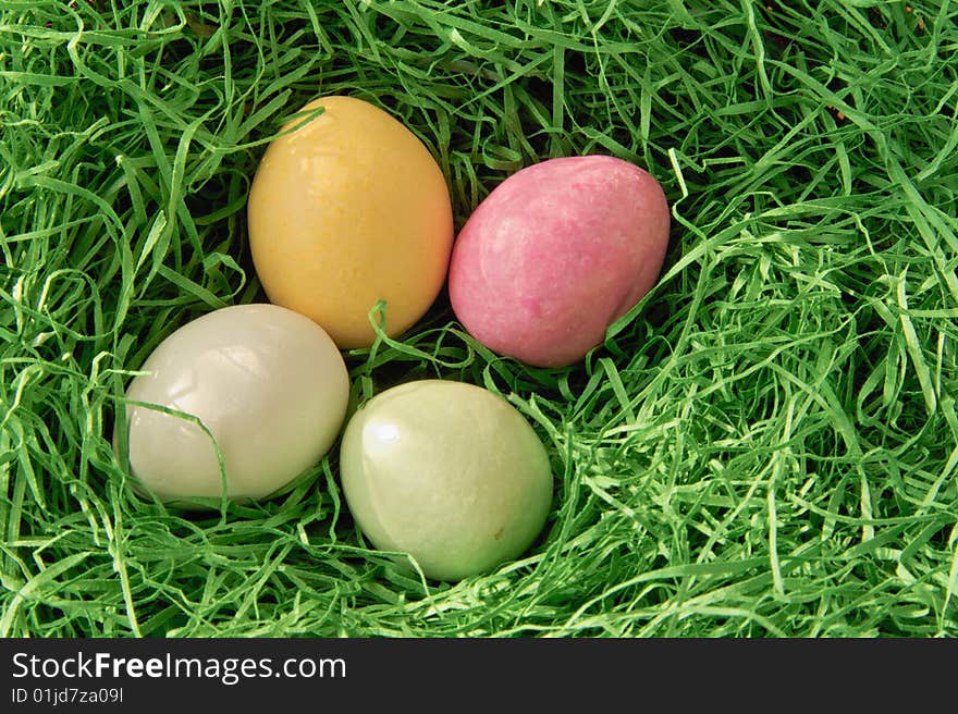 Four Eggs inside a Nest of Grass. Four Eggs inside a Nest of Grass