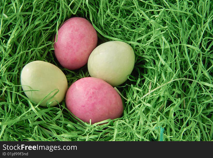 Four Eggs inside a Nest of Grass. Four Eggs inside a Nest of Grass