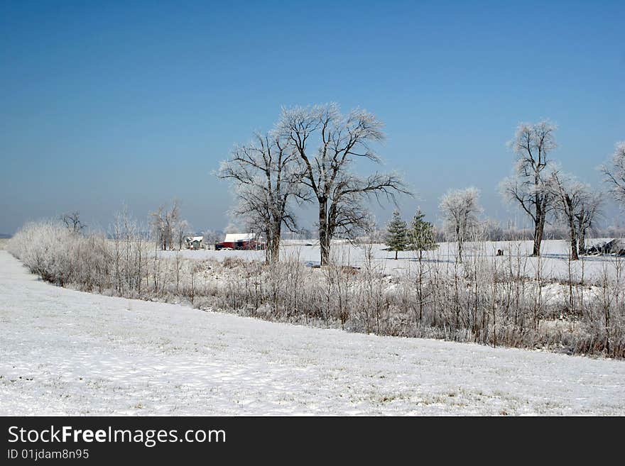 Rural farm in snow and ice setting. Rural farm in snow and ice setting