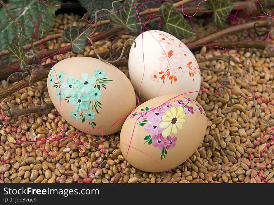 Easter retirement with Easter egg ivy - berry against a background from corn. Easter retirement with Easter egg ivy - berry against a background from corn.