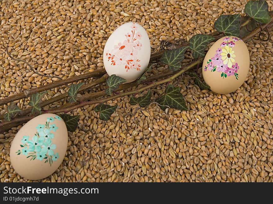 Easter retirement with Easter egg ivy - berry against a background from corn. Easter retirement with Easter egg ivy - berry against a background from corn.