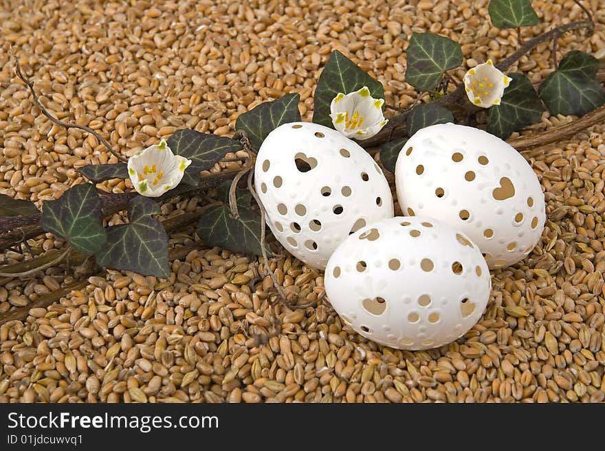 Retirement with ivy - berry and Easter egg against a background from corn.