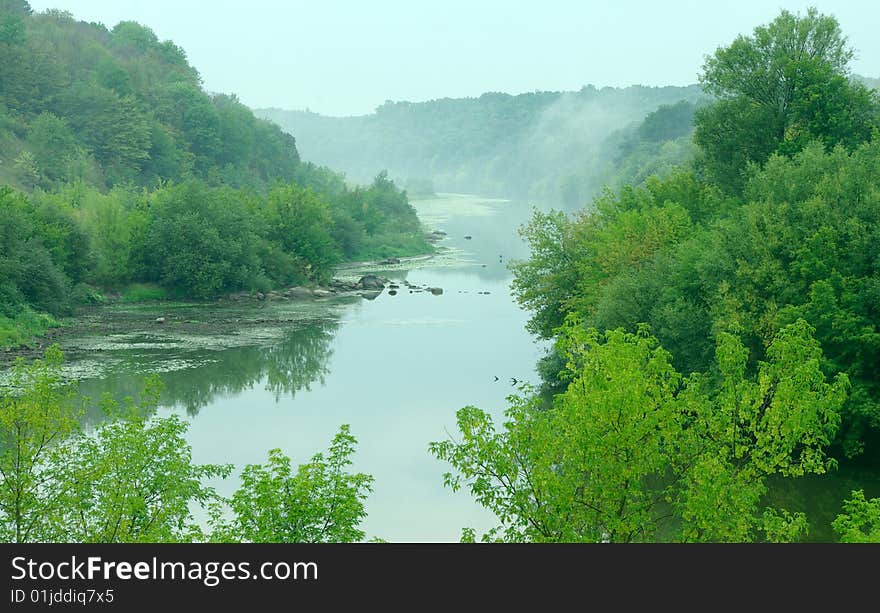 Landscape - meadow, the blue sky and river