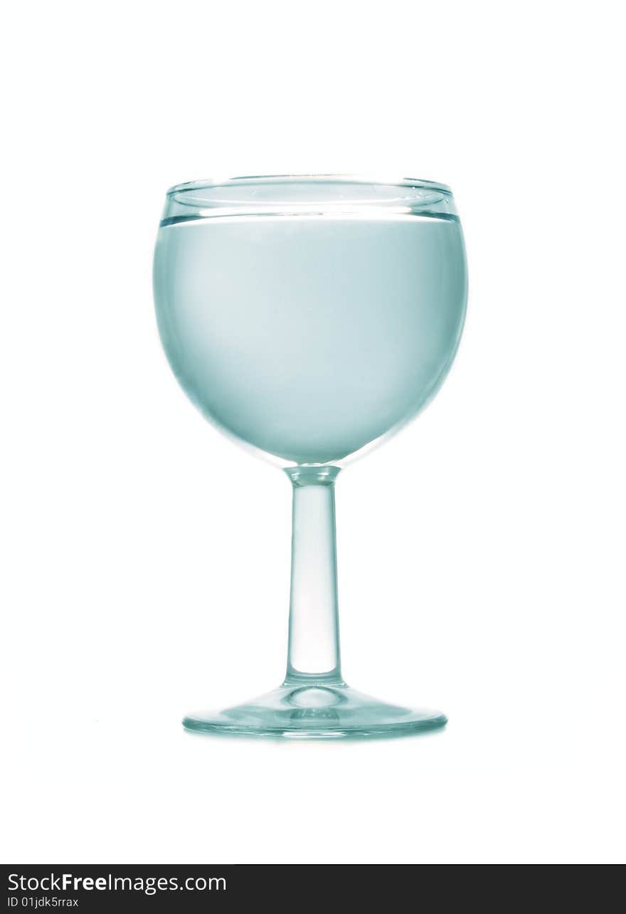 Wineglass full of water on the white background