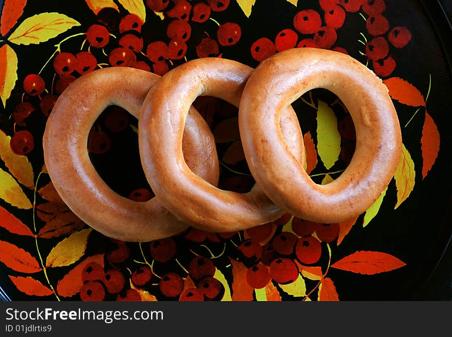 Bagels on tray with mountain ash pattern