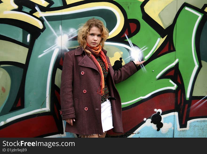 Girl Standing In Front Of A Graffiti Wall