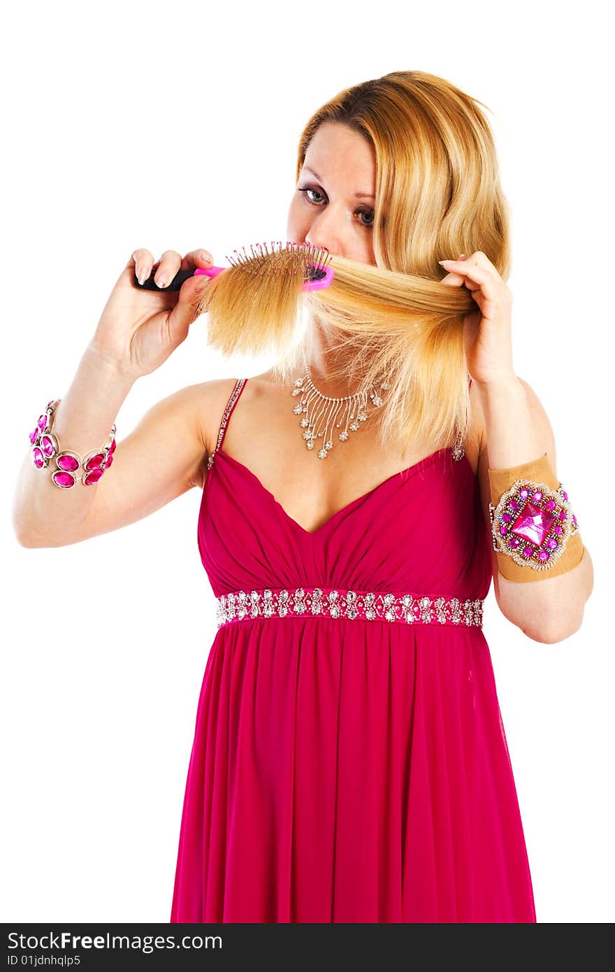 Long hair blond woman with hairbrush in her hand. Long hair blond woman with hairbrush in her hand