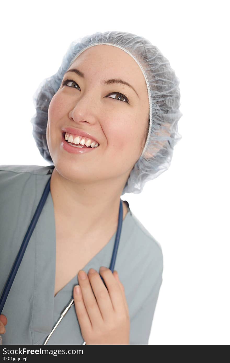 Smiling young healthcare worker in scrubs and surgical cap. Smiling young healthcare worker in scrubs and surgical cap