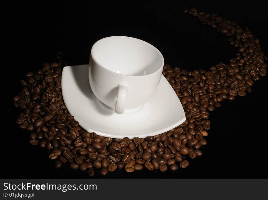 Coffee cup with highlited coffee beans