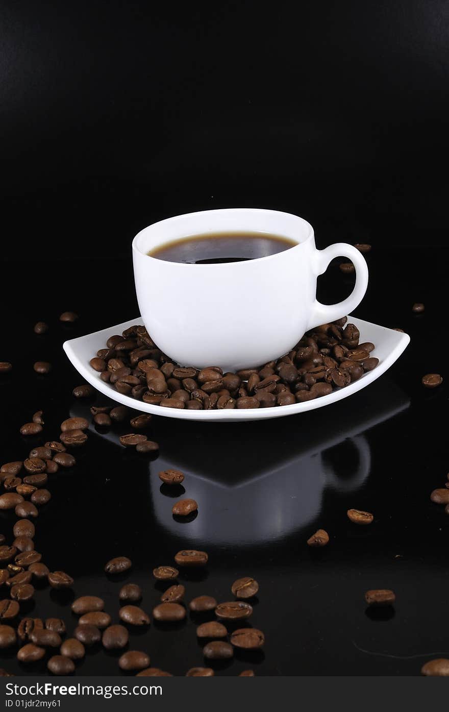 Coffee cup with highlited coffee beans