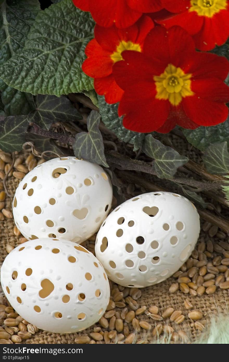 Easter decoration with primrose,Easter egg against a background from corn.