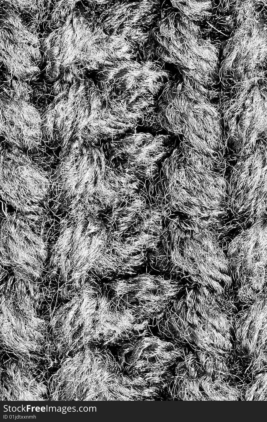 A close-up of the texture of grey woolen fabric. A close-up of the texture of grey woolen fabric