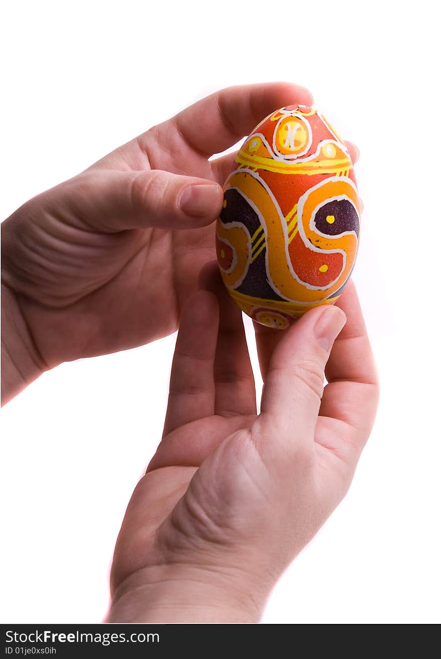 Colorful Easter egg in  hands.