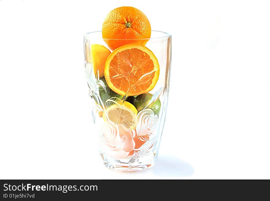 Oranges, lemons and limes in the big glass vase with clipping path. Oranges, lemons and limes in the big glass vase with clipping path.