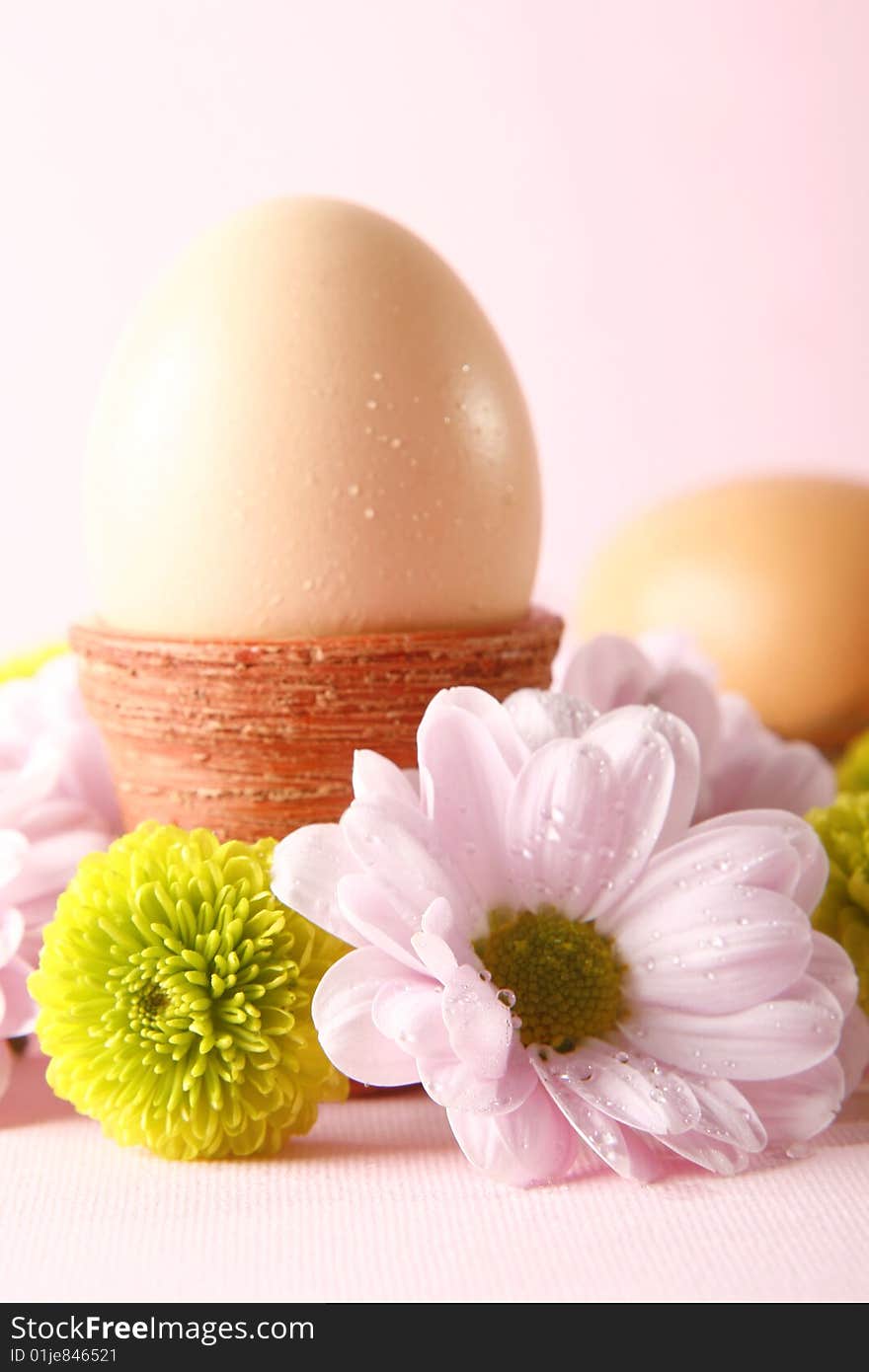 Easter eggs with fresh flowers