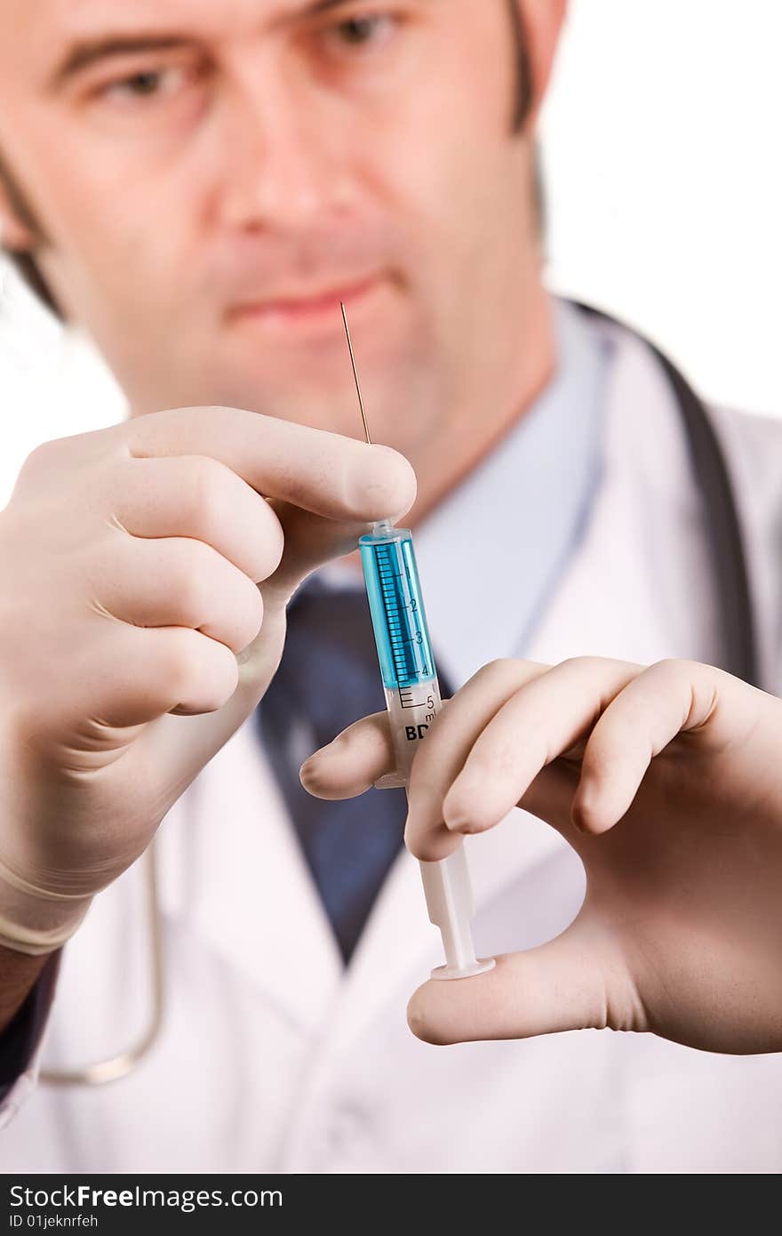 Male medic holding syringe. Isolated