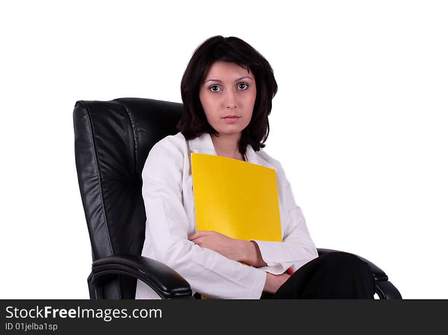 Young business woman sitting on the chair and holding a report. Young business woman sitting on the chair and holding a report