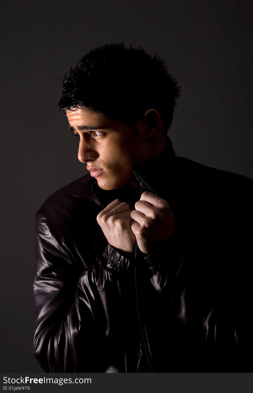 Fashion portrait of teenager over grey background