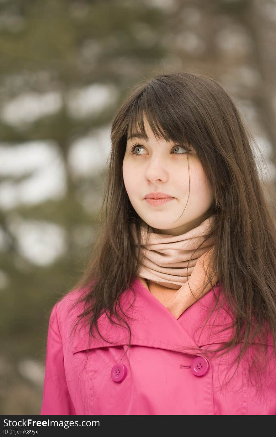 A portrait of sad young woman in the spring park looking up. A portrait of sad young woman in the spring park looking up